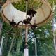 Vintage brass onyx floor lamp with fringed shade.
