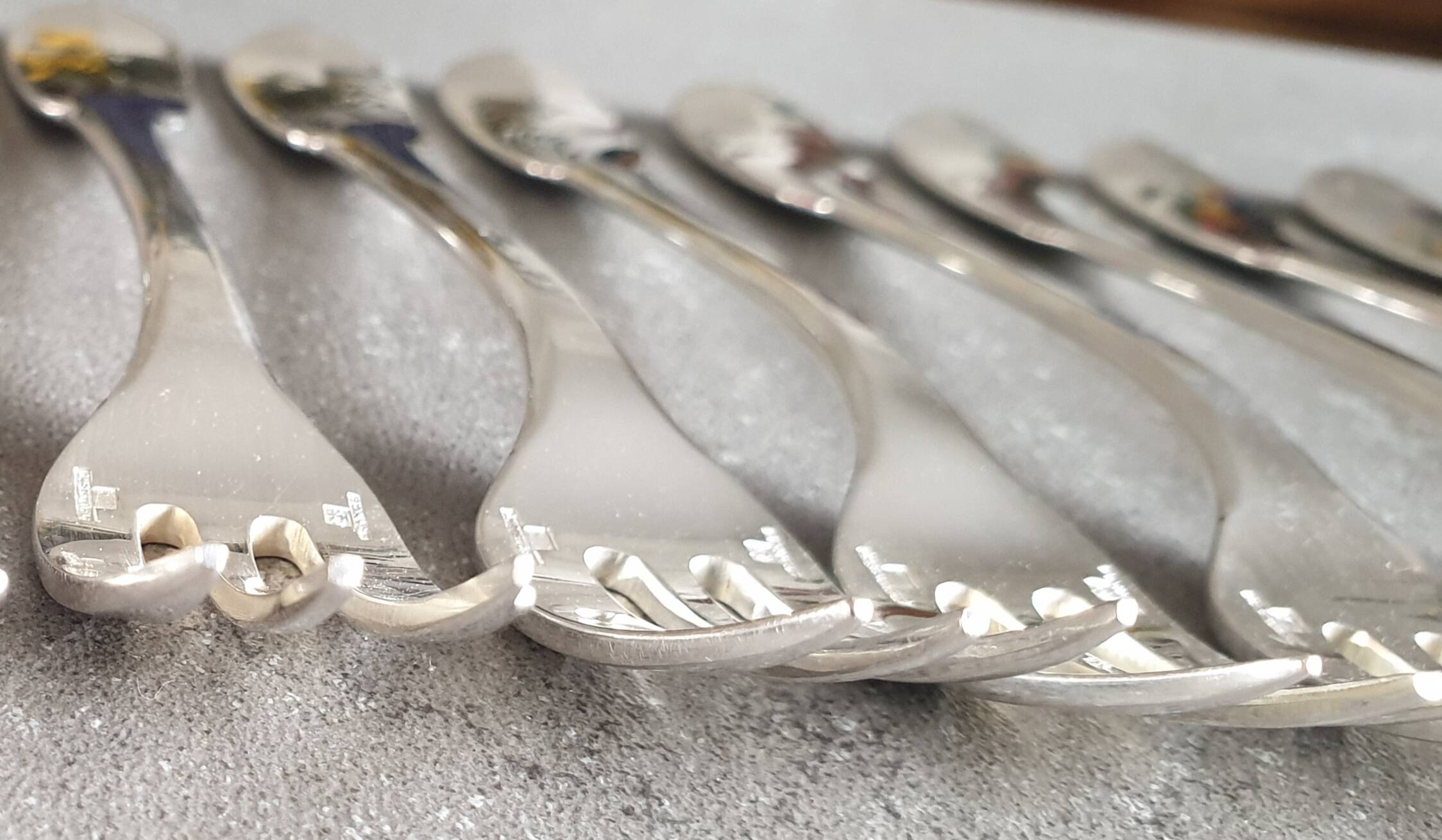 Set of 12 dessert forks and a cake server.