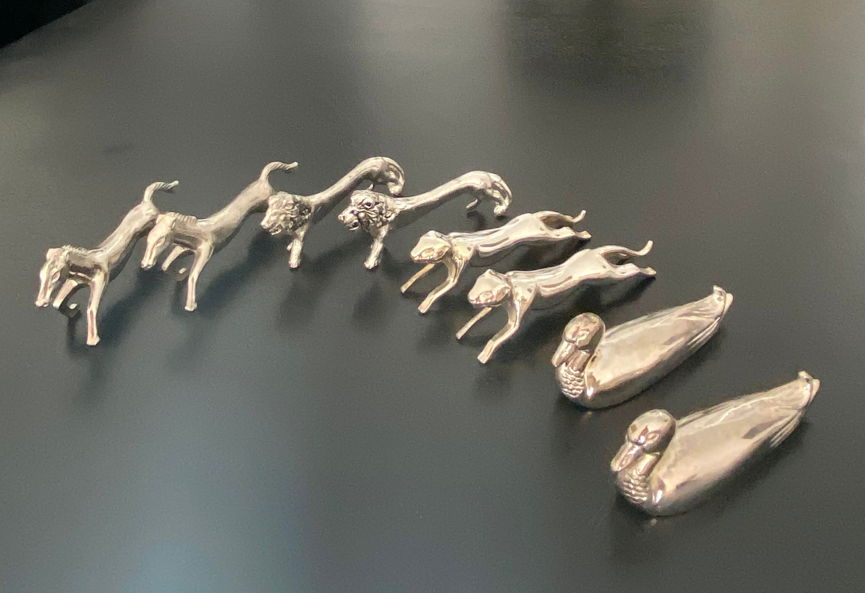 8 various animal knife holders in silver metal