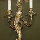 Pair of antique wall sconces from the 1920s in gilded bronze.