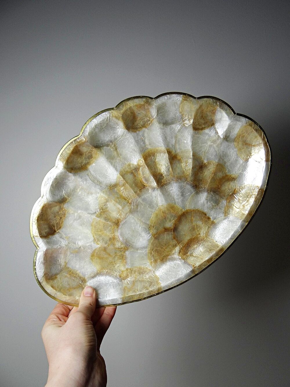 Large platter or shell-shaped catchall in capiz mother-of-pearl and vintage brass.