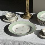 Set of 9 vintage turquoise deep plates with gold trim and pink flowers.
