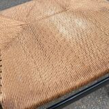 4 black Scandinavian chairs with solid wood and cord.