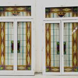Pair of two-leaf windows in 20th century Art Deco stained glass