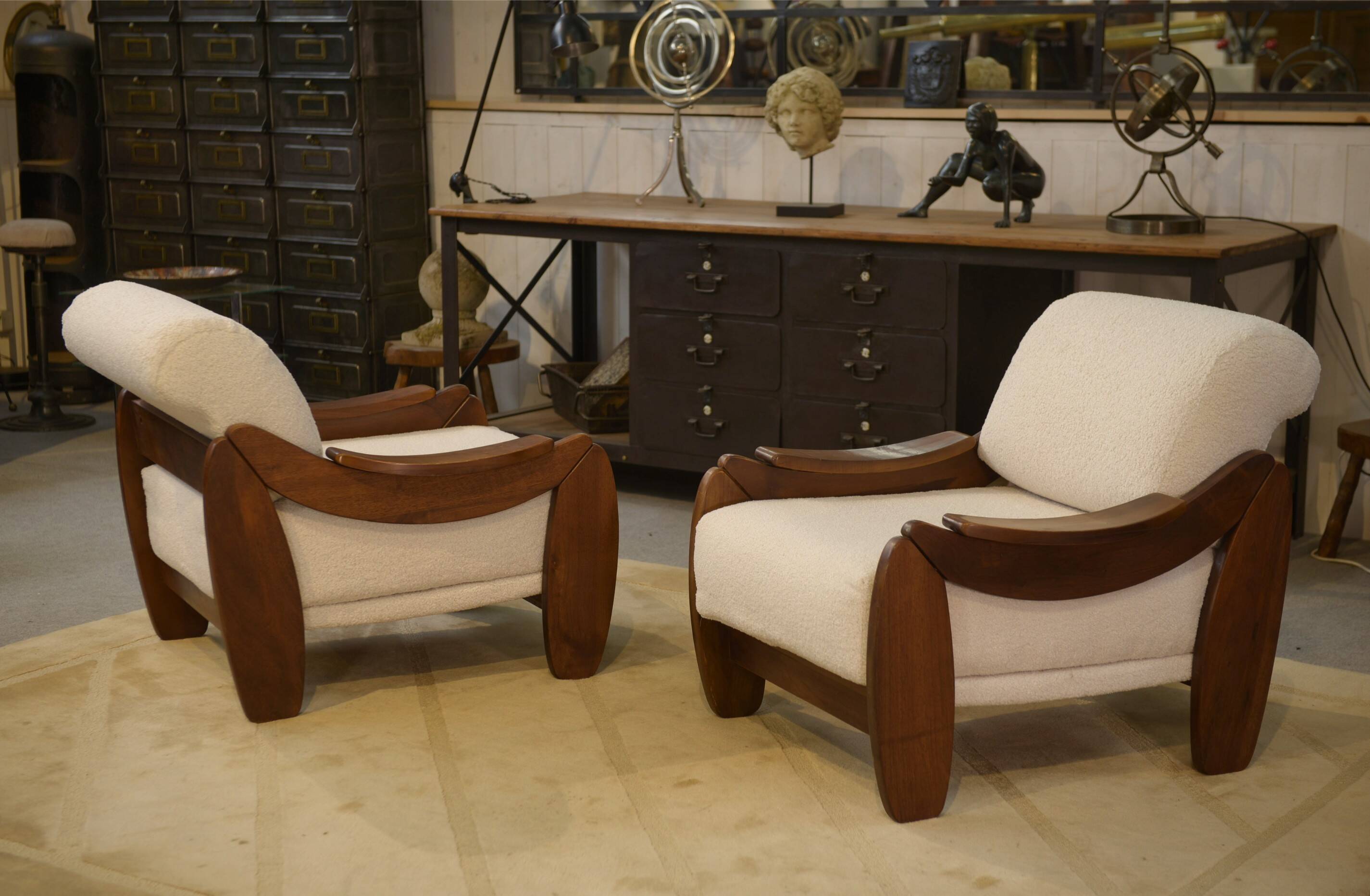 Brutalist pair of armchairs in mahogany and cream boucle 1970s.