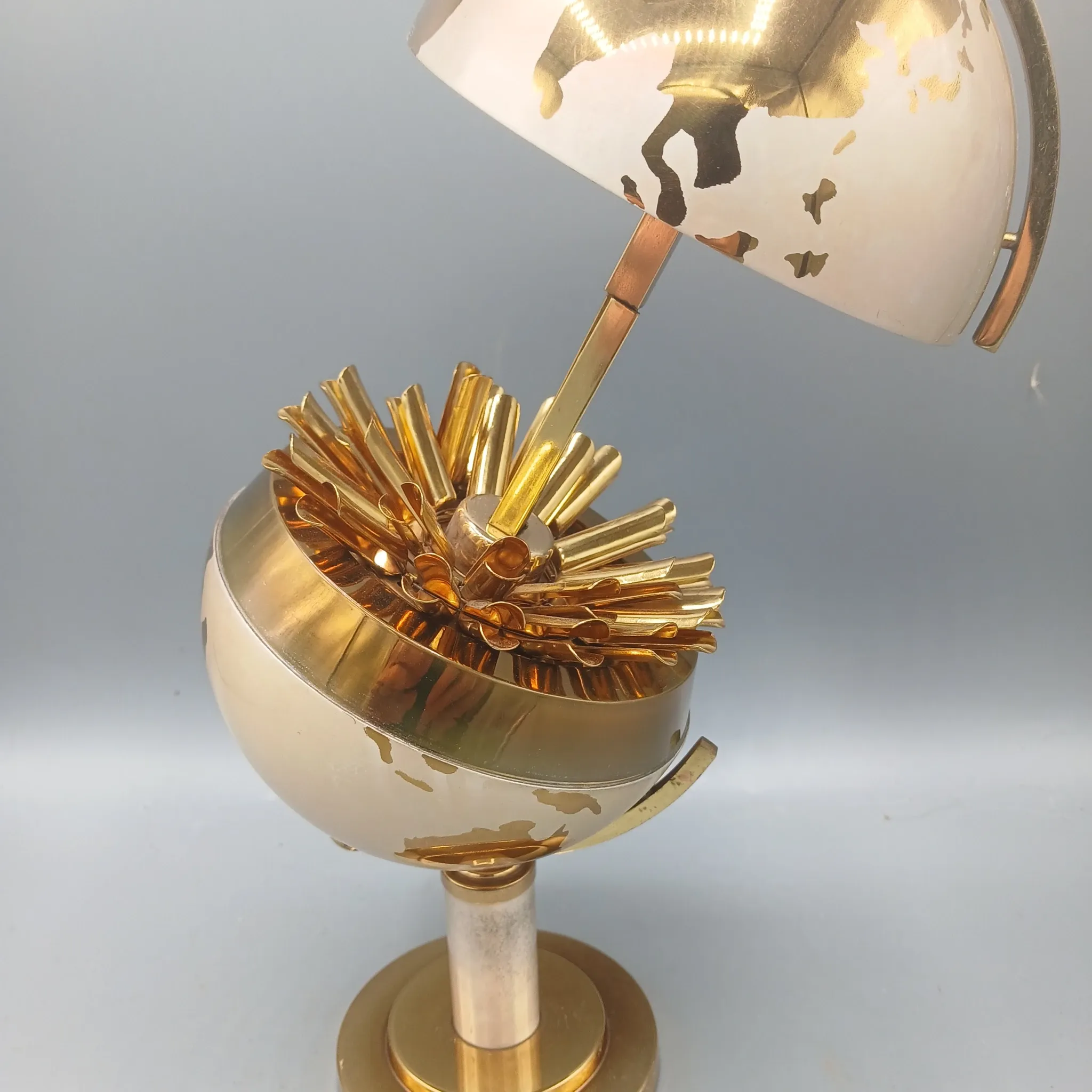 Vintage brass globe cigarette dispenser