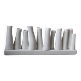 set of decorative vases composed of 11 white ceramic soliflores, evoking the delicate appearance of coral. In good general condition, despite some chips. Dimensions: 29.5 * 5.2 * 11.5 cm.