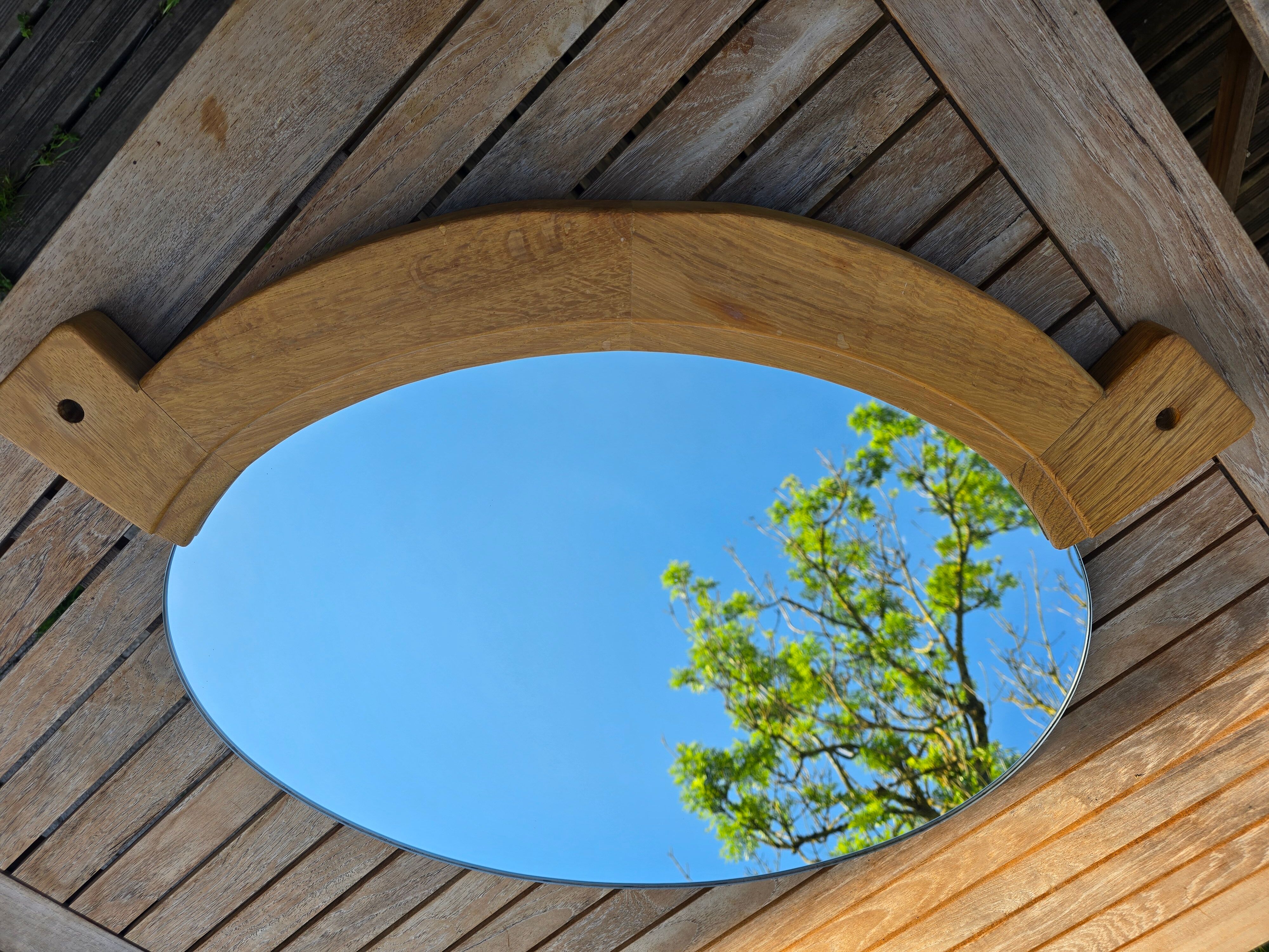 Oval mirror by Guillerme and Chambron