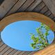 Oval mirror by Guillerme and Chambron