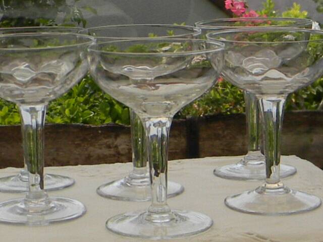 Set of 6 antique glass champagne glasses.