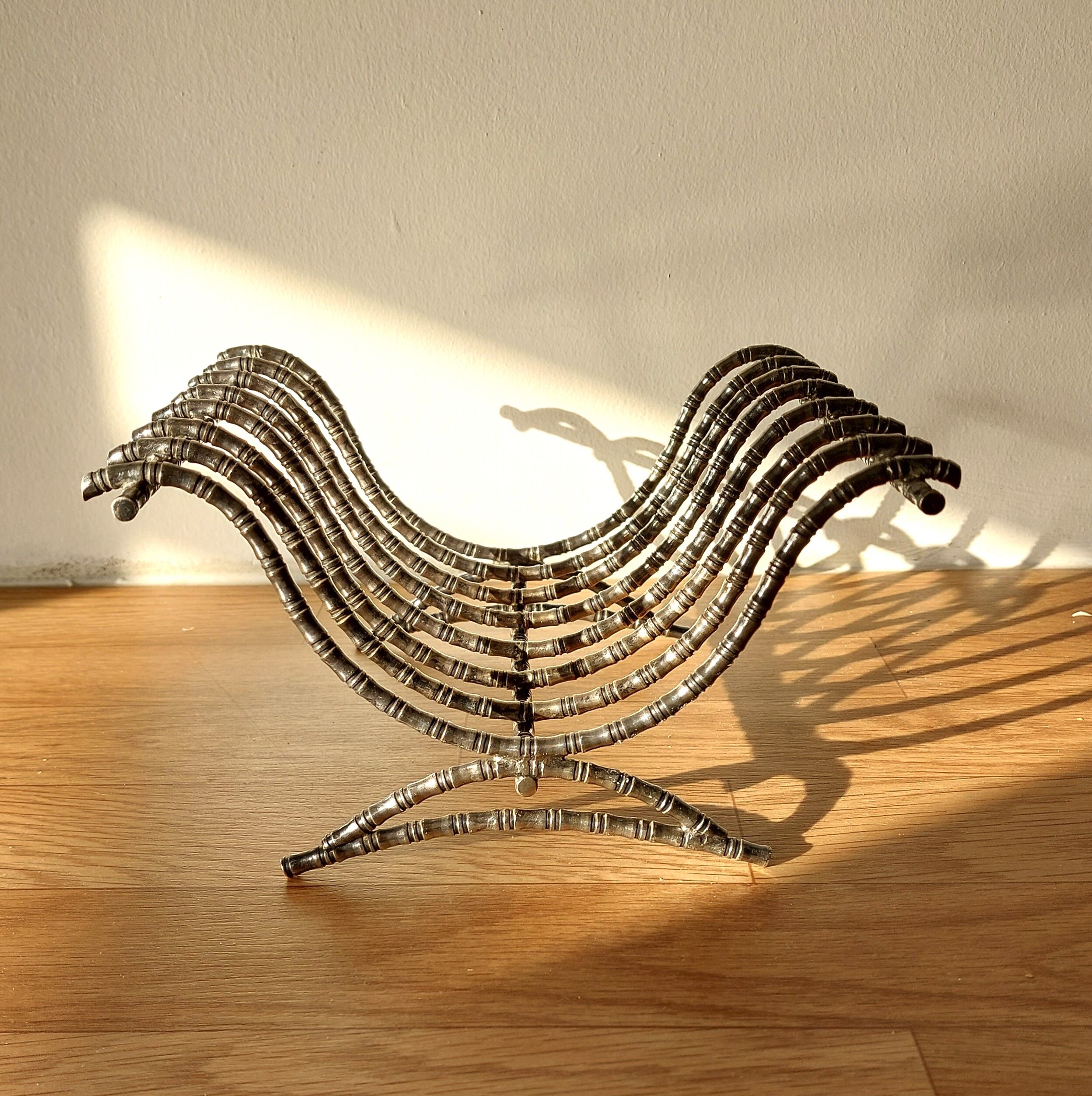 Silver metal cut in imitation of vintage bamboo.