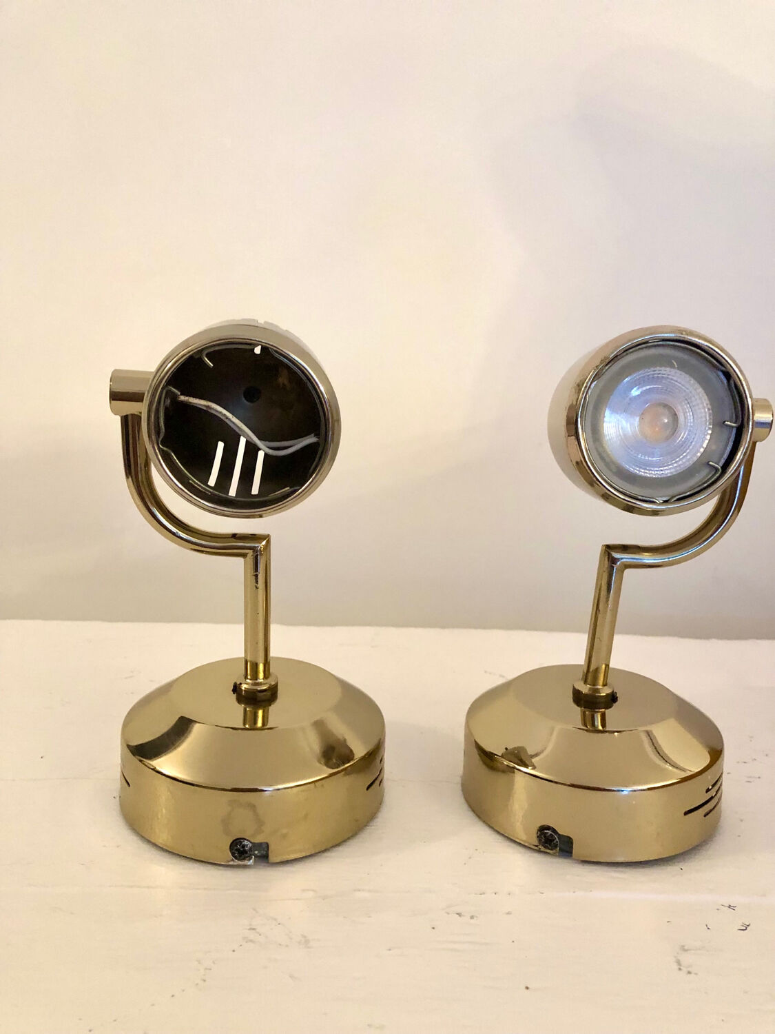 Vintage Fase adjustable wall lights in gold metal.