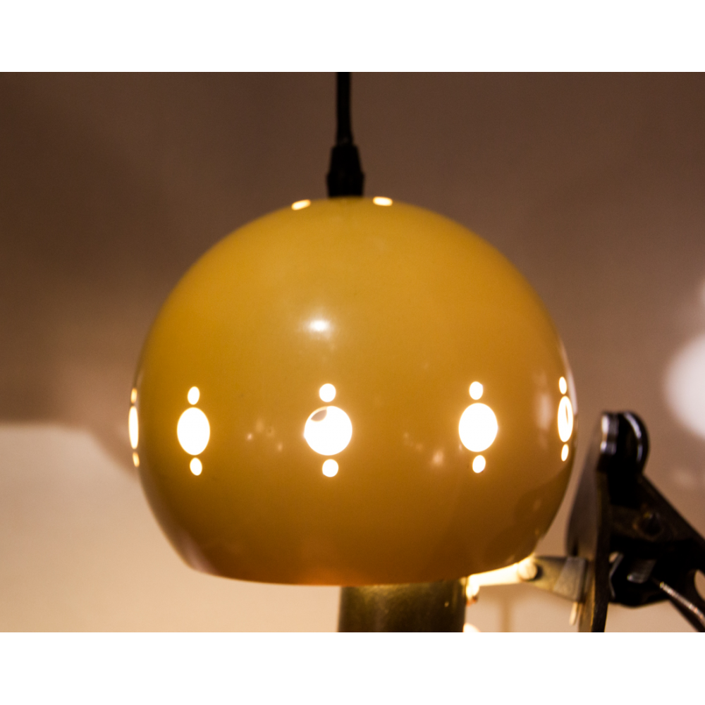 Suspension yellow lacquered metal perforated geometric patterns.