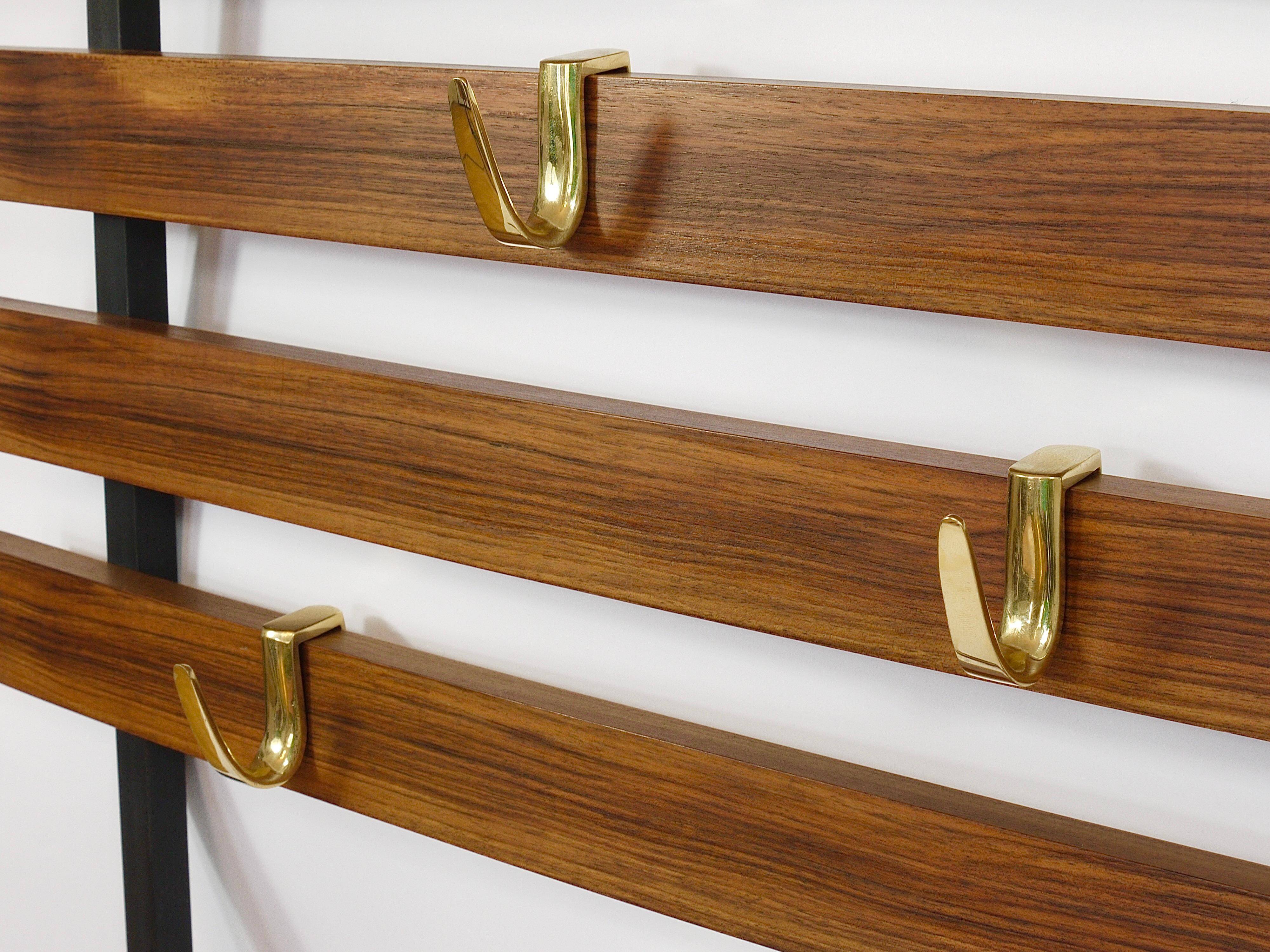Wall coat rack by Carl Aubock with 5 brass hooks, walnut, iron, Austria, 1950s.