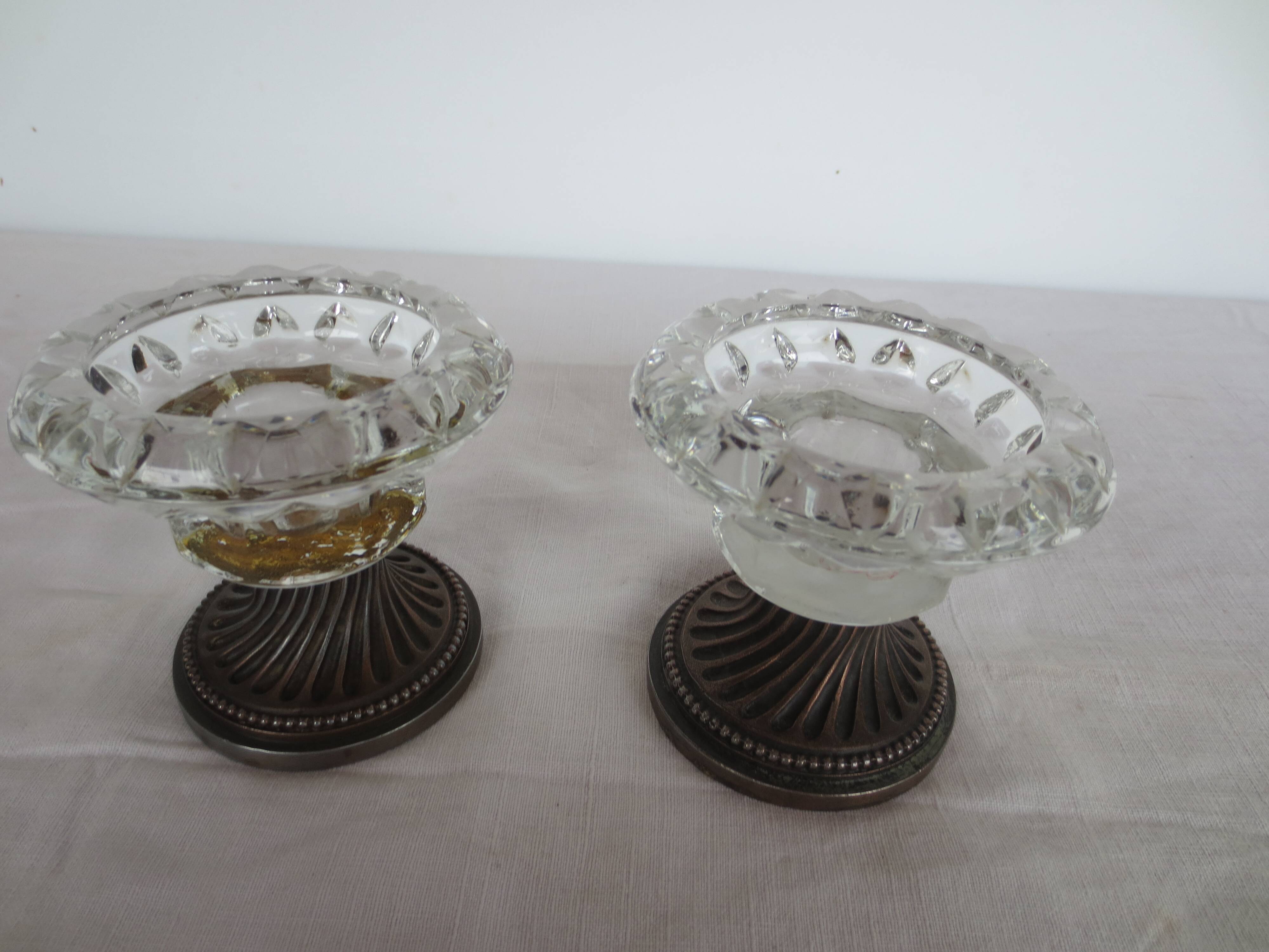Two candle holders in bronze and crystal