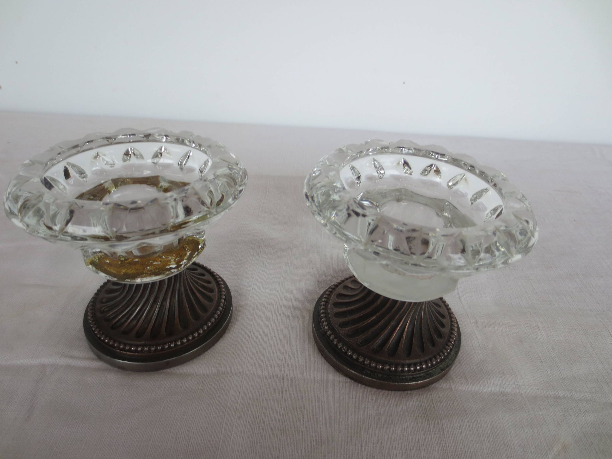 Two candle holders in bronze and crystal