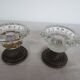 Two candle holders in bronze and crystal