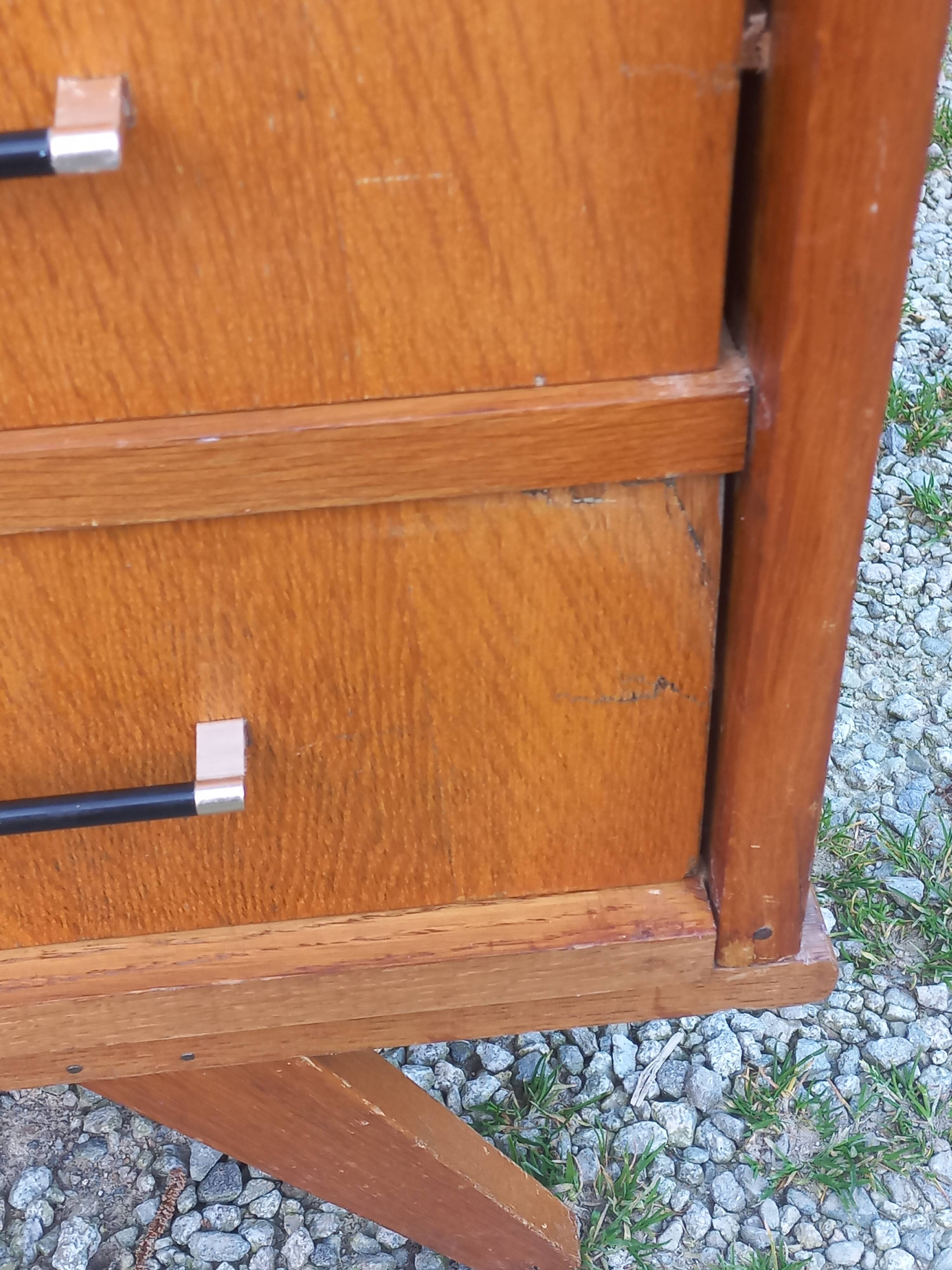Vintage oak commode with tapered legs and wings from the 1950s.