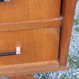 Vintage oak commode with tapered legs and wings from the 1950s.