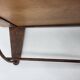 Wall shelf in wood and metal with a decoration of ice skaters.
