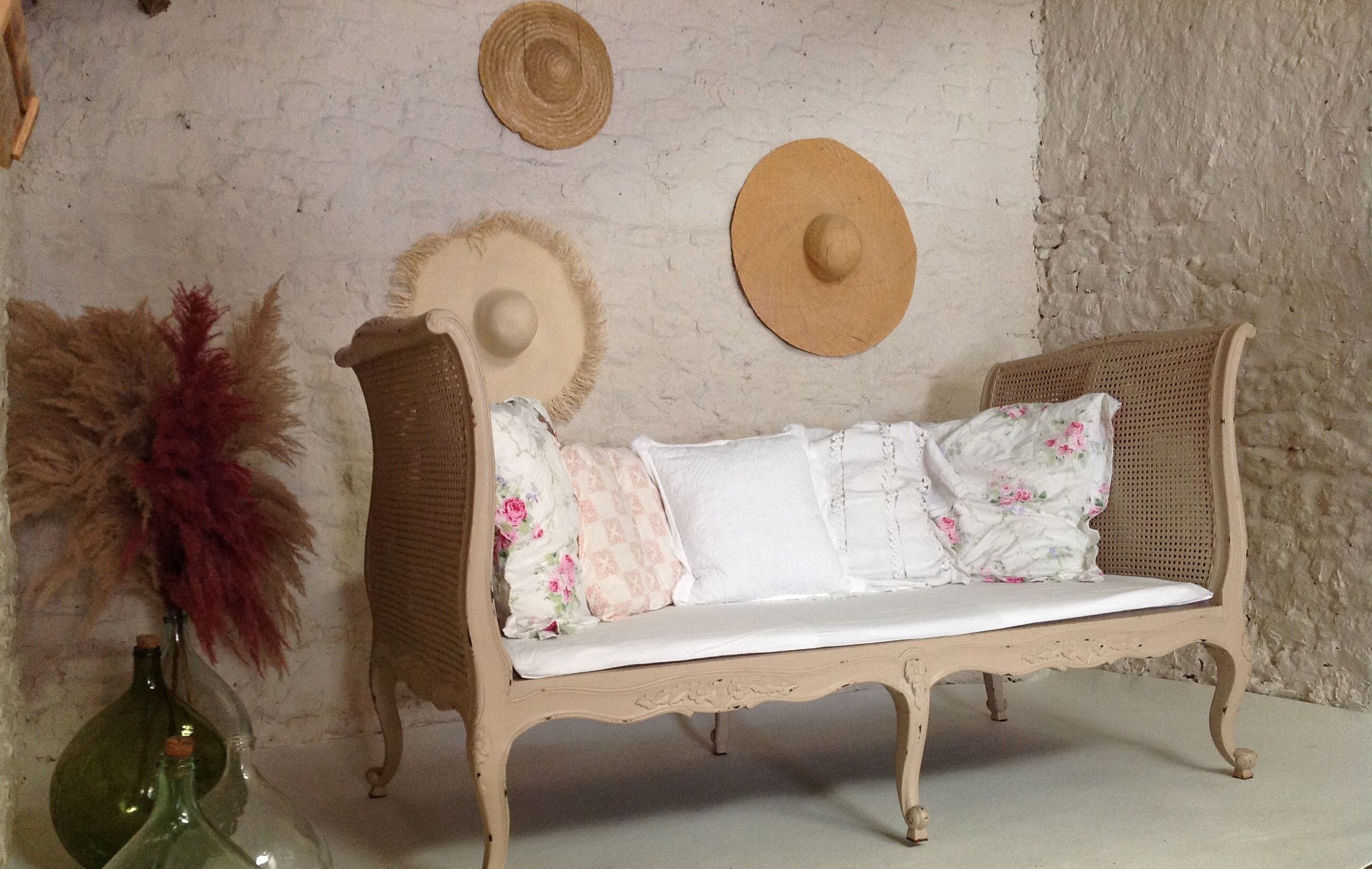 Carved wooden bench and caning bed