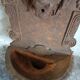 Old cast iron wall fountain with lion's head