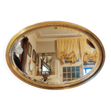 Old oval beveled golden mirror