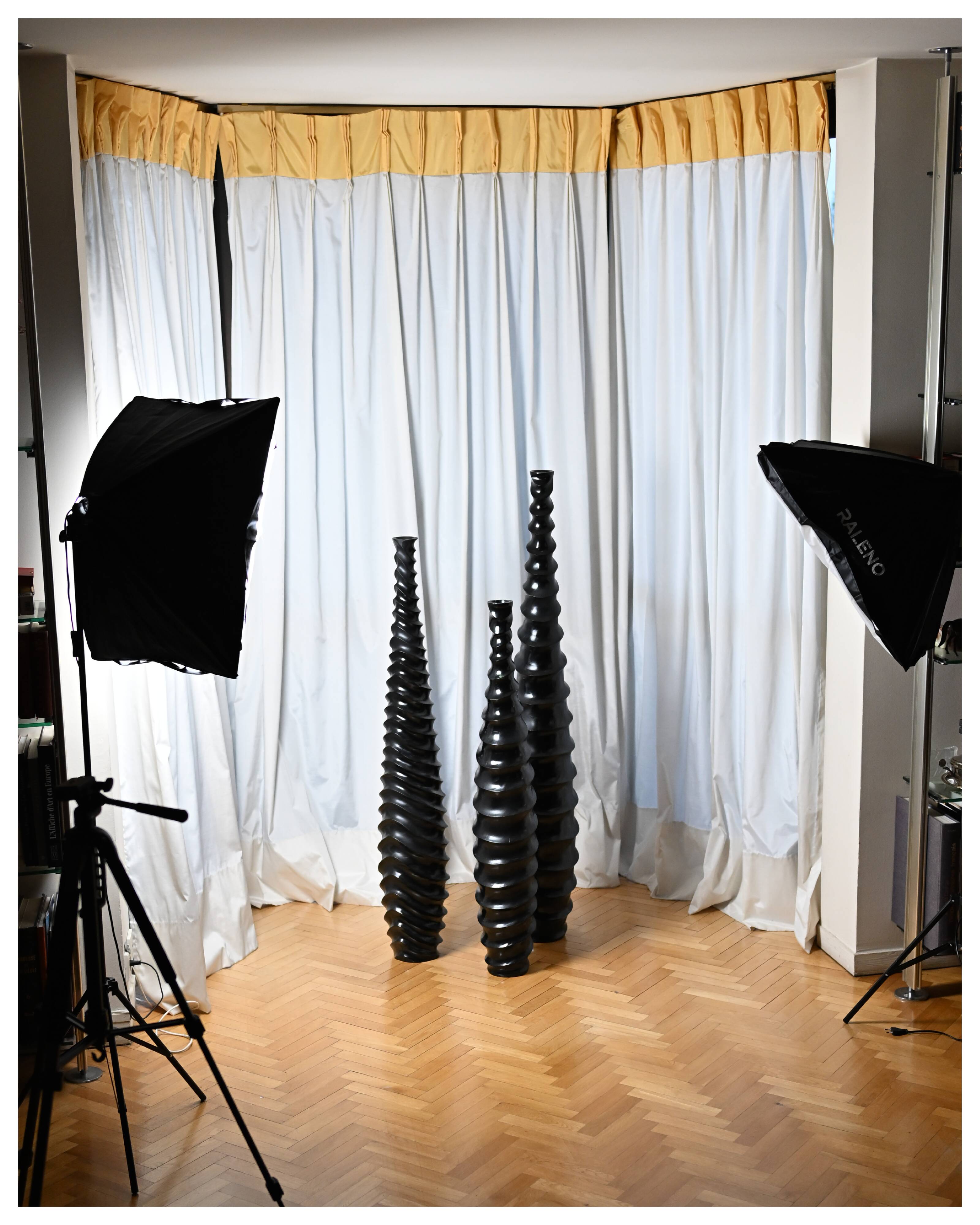 Set of 3 large black vases made of wood and black lacquered.