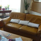 Tan leather sofa with natural graining, matching armchair and pouf