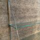 Half-moon design shelf in chromed metal and glass
