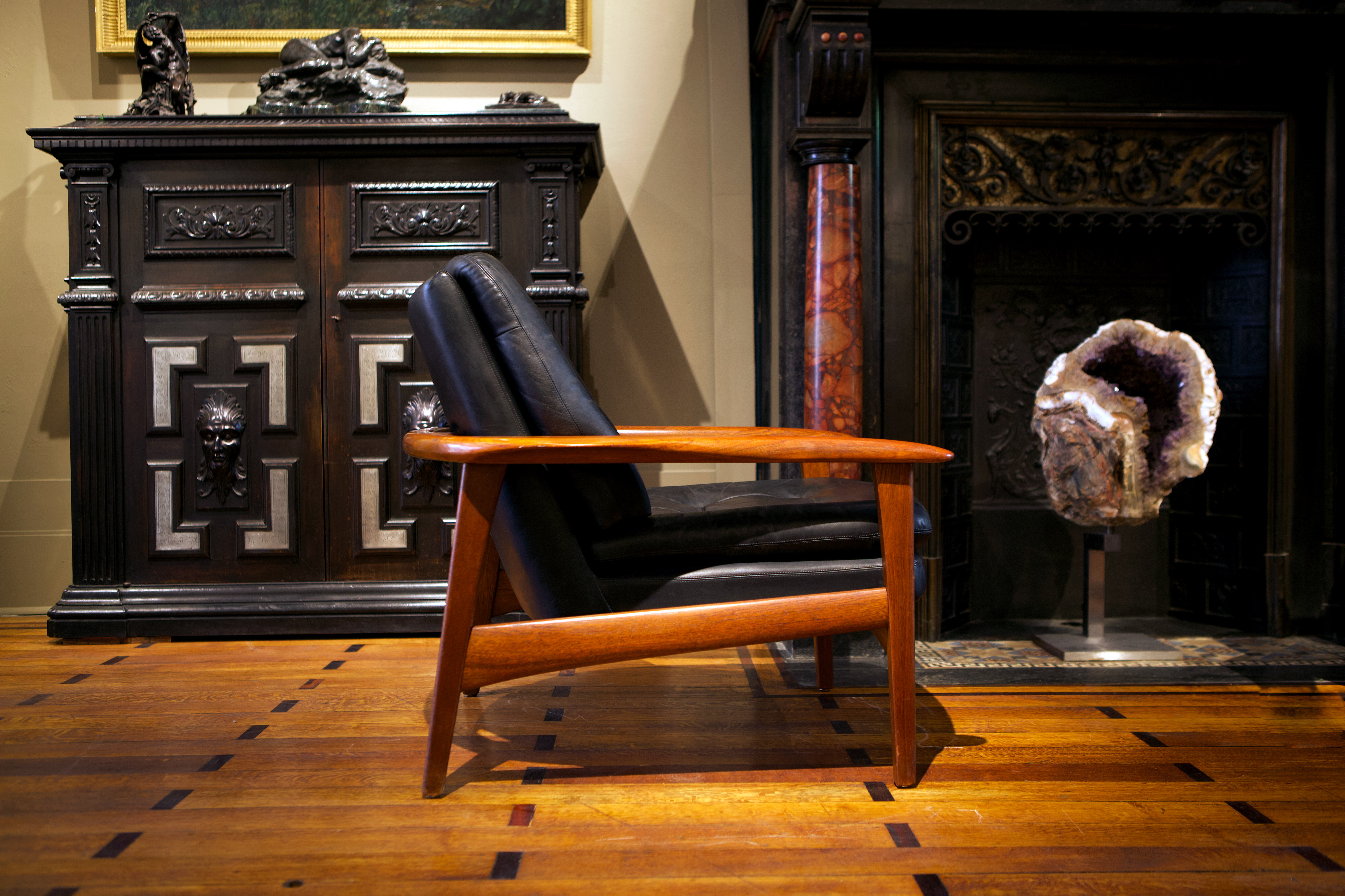 Pair of scandinavian armchairs in black leather and teak