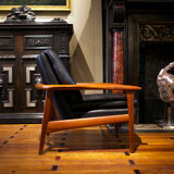 Pair of scandinavian armchairs in black leather and teak