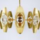 Oscar Torlasco brass chandelier of 25 inches with optical prism lenses, Italy, 1970s.