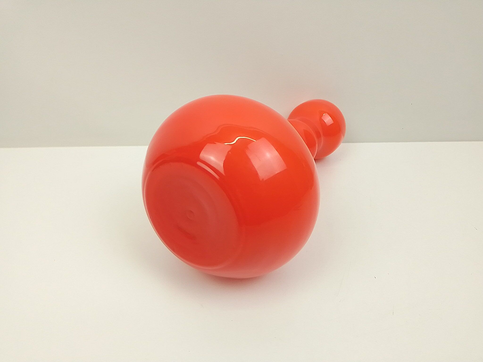 Orange glass vase and white interior