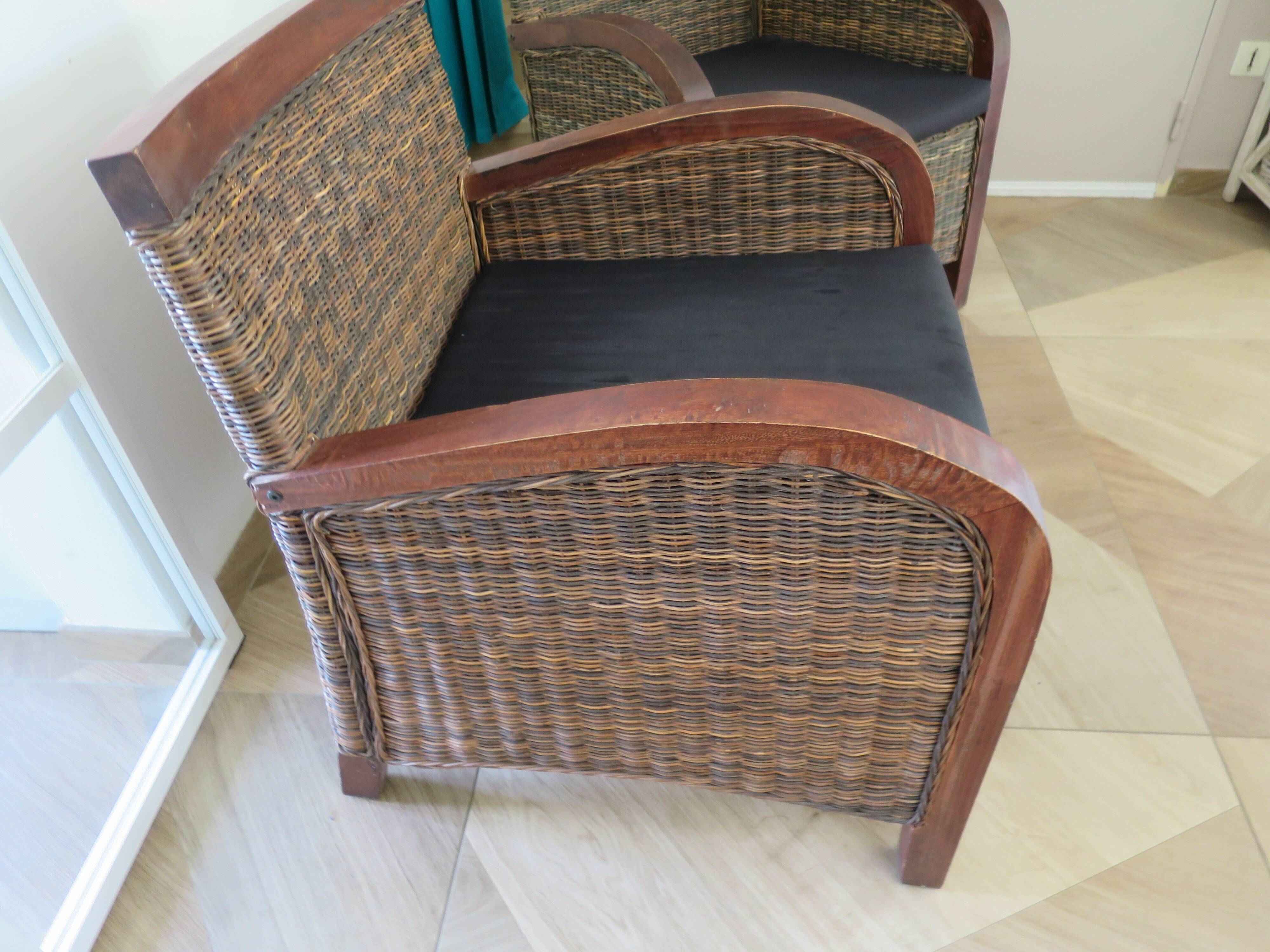 2 colonial-style armchairs in woven rattan and exotic wood