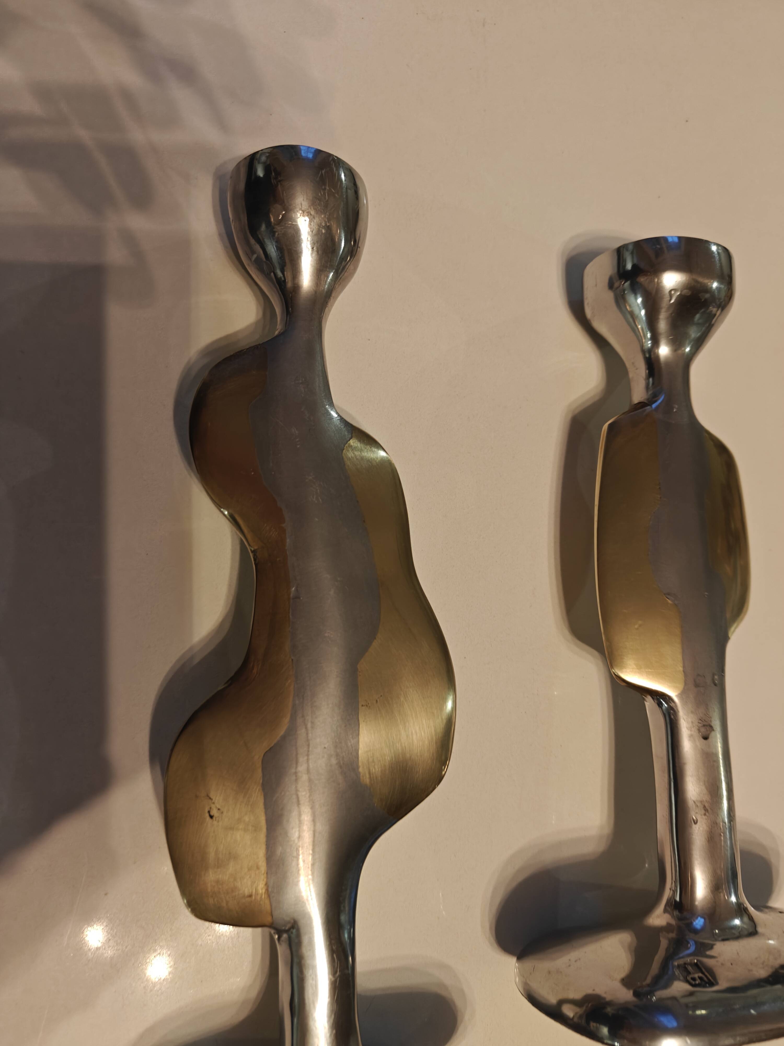 Pair of large candlesticks by David Marshall