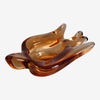 Old empty pocket/swallow ashtray in amber glass