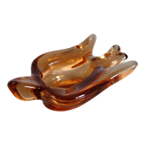 Old empty pocket/swallow ashtray in amber glass