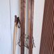 Antique wooden skis with vintage poles