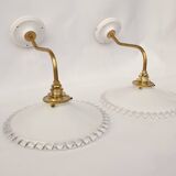 Swan neck sconces in serrated opaline