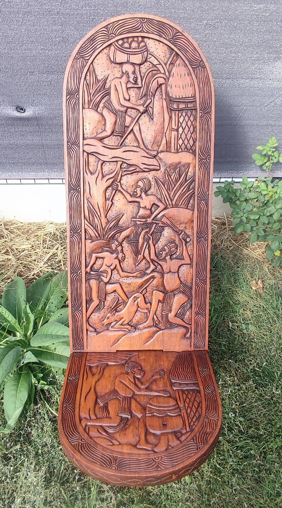 Old African wooden carved talking chair.