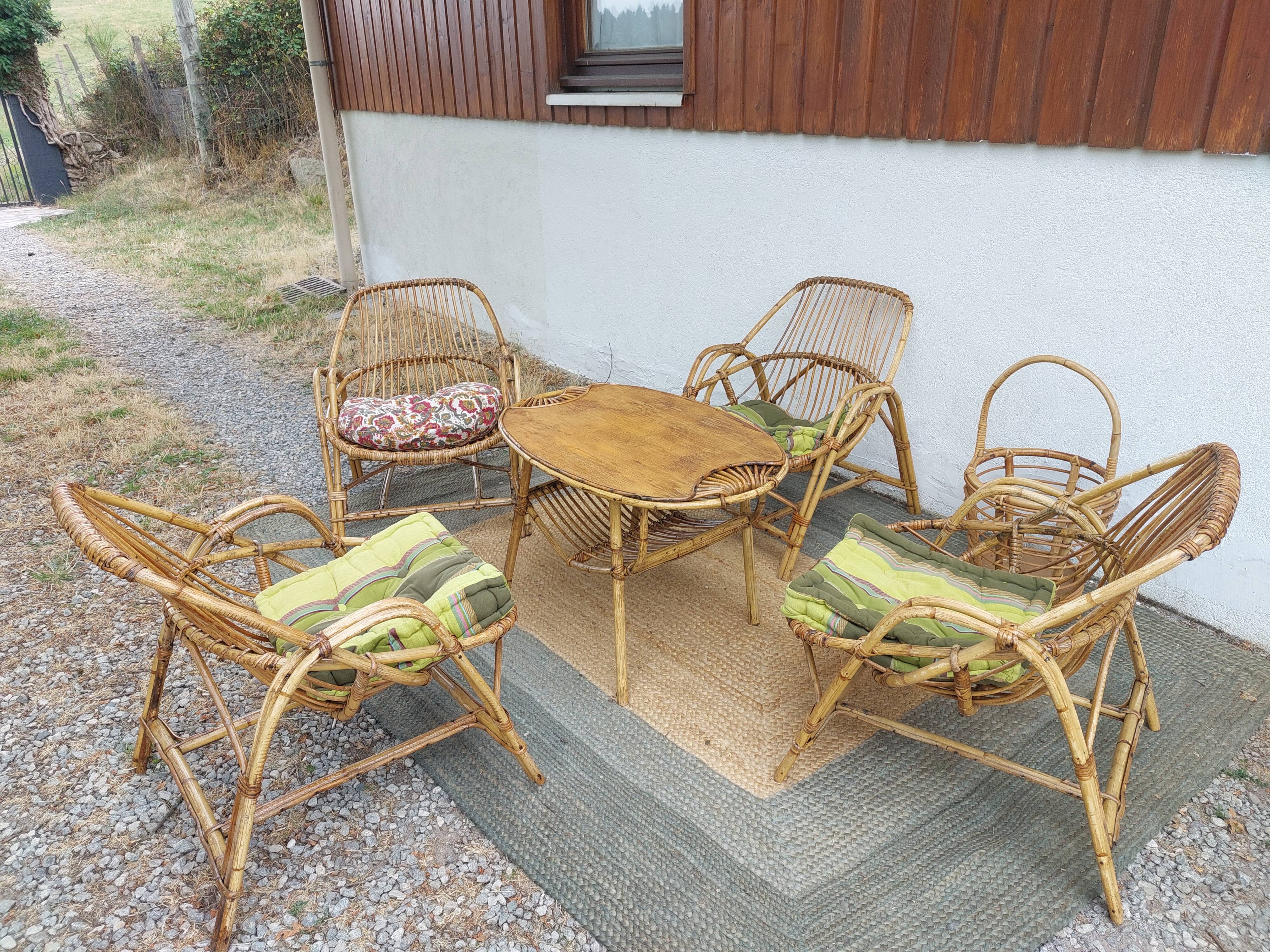 4 armchairs and a coffee table made of rattan and bamboo wood, vintage.