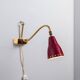 Brass wall lamp with perforated metal shade, 1950s, Sweden