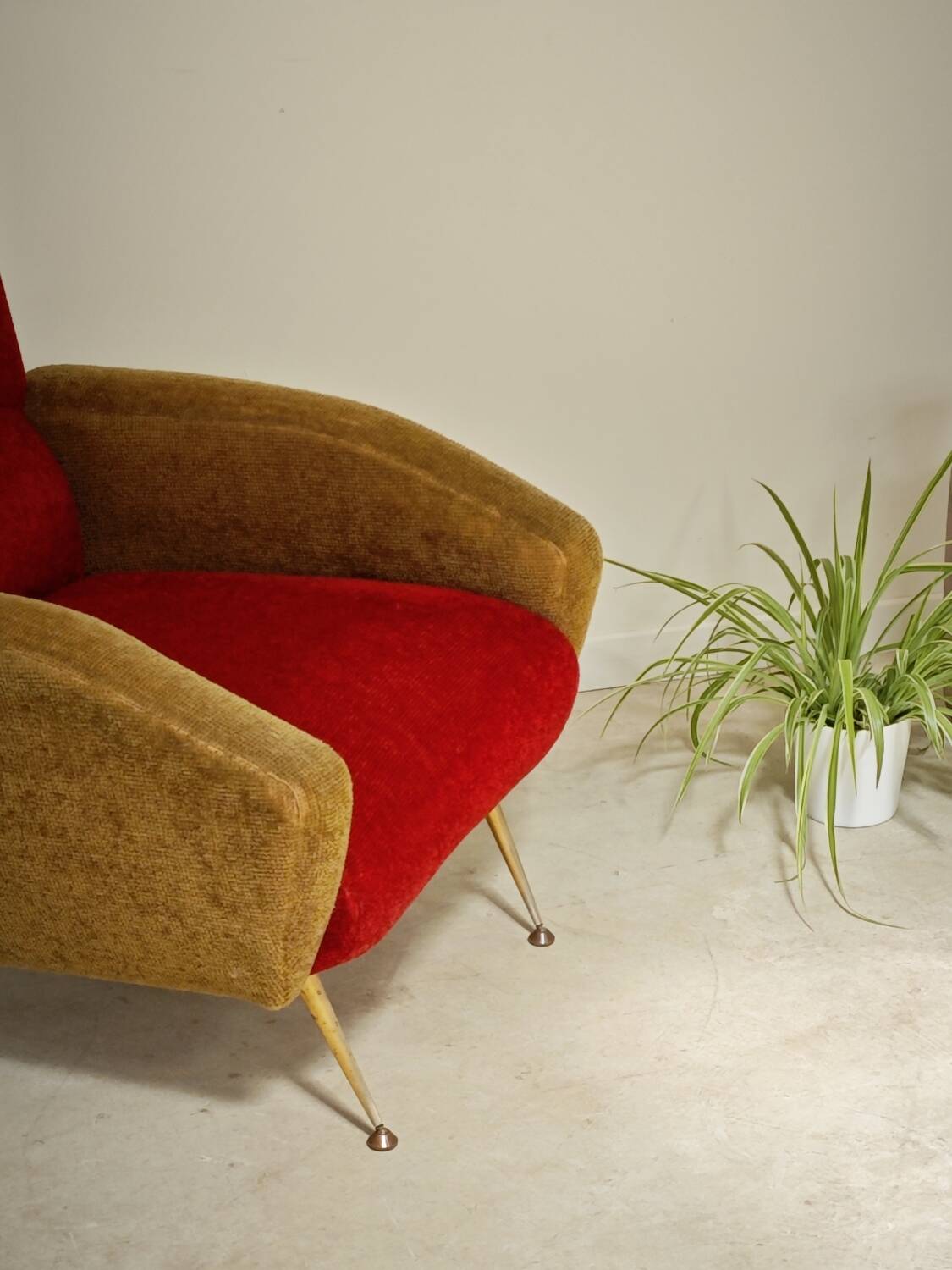 Red and mustard yellow fabric armchair in 1970s style