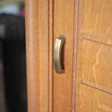 Vintage wooden wardrobe with sliding doors.