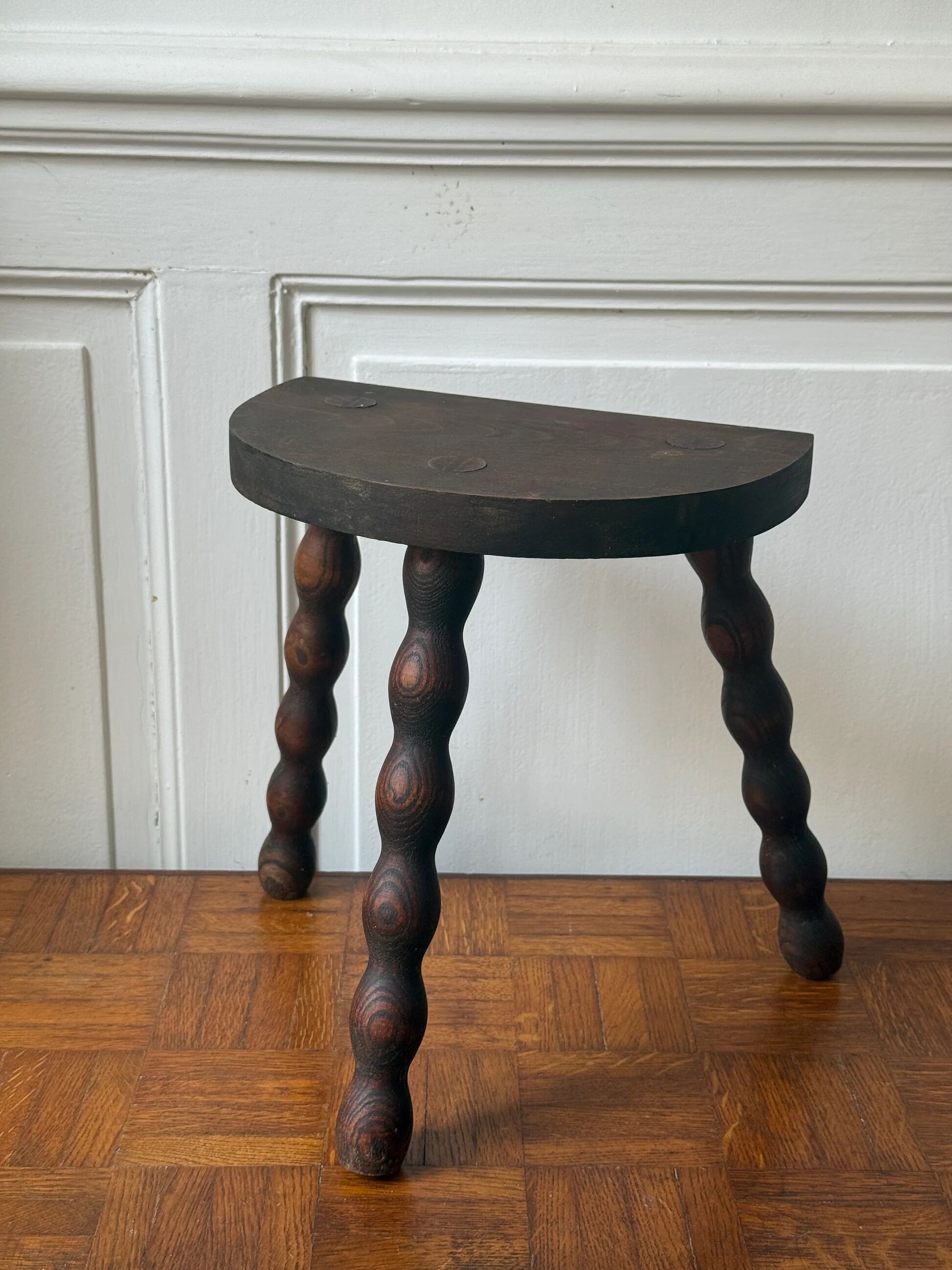 Three-legged turned wooden stool