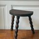 Three-legged turned wooden stool