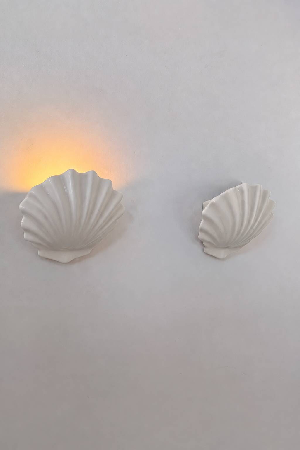 Vintage pair of white porcelain wall lights, France 1970.
