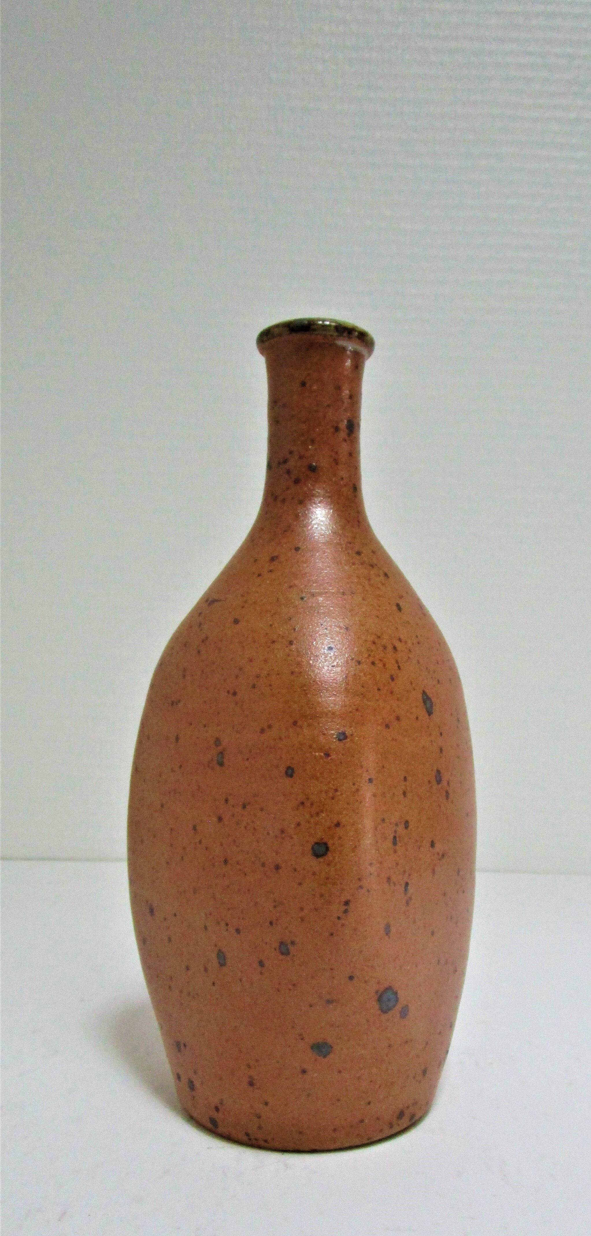 Soliflore vase in pyrite sandstone with three vintage faces