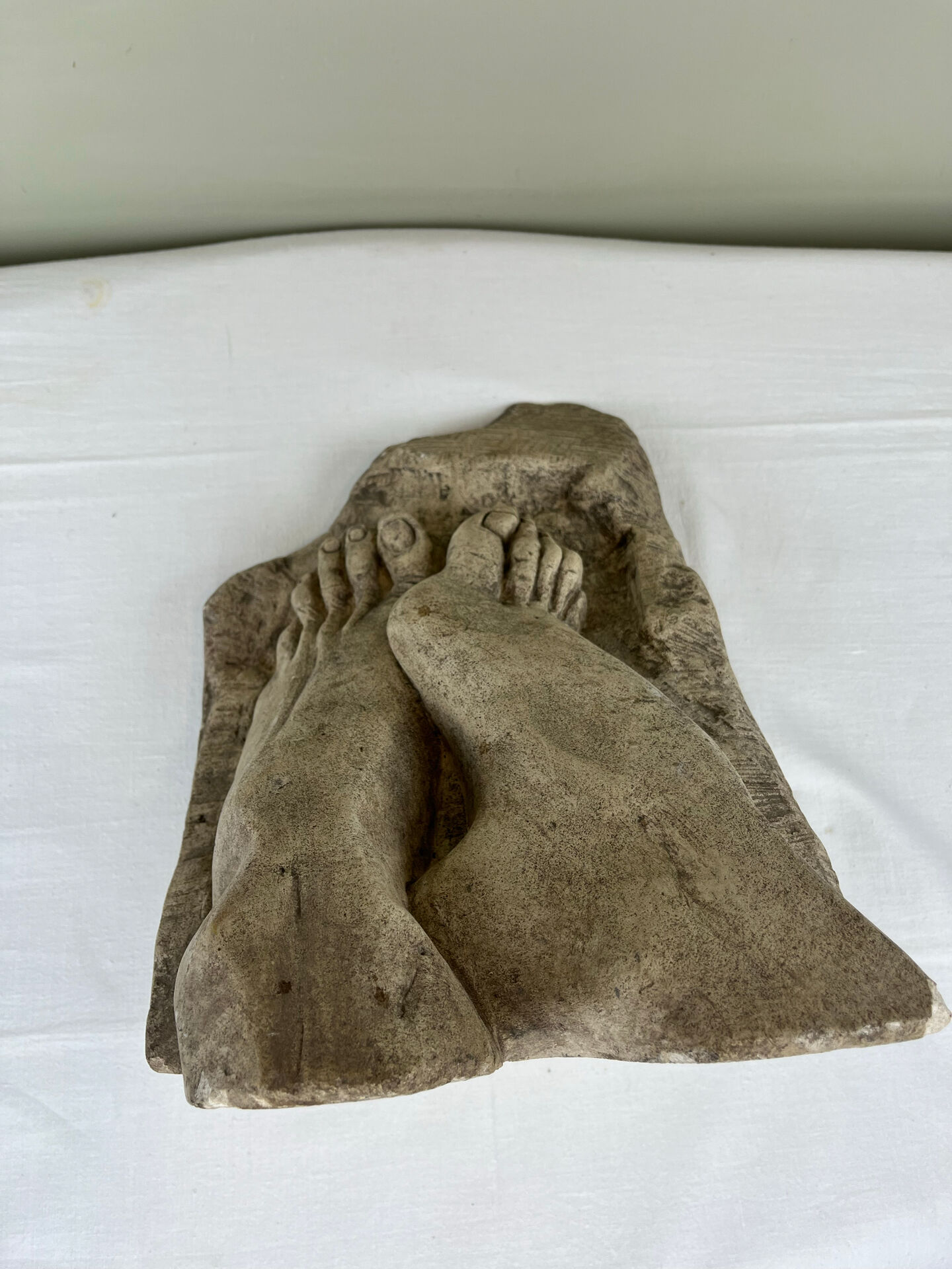 Stone sculpture, two feet on a block, signed D. Paillot.